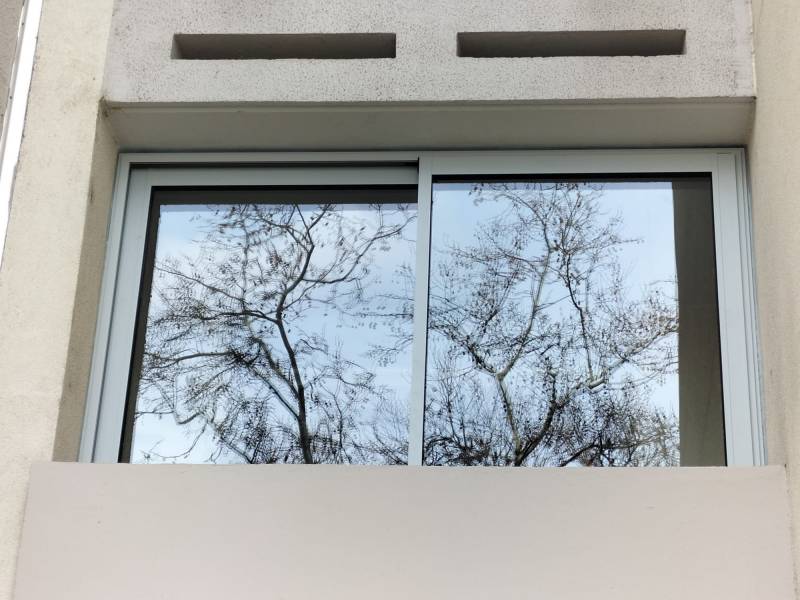 Installation d'une fermeture de balcon en PVC à Lyon